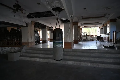 DSC_7579: an empty room with a punching bag hanging from the ceiling