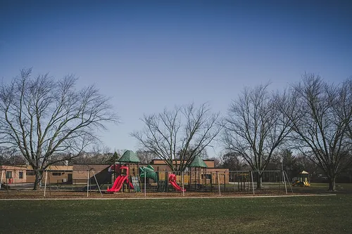 Mt. Pleasant, MI - An elementary school playground sits empty during the lunch hour - usually a beautiful spring day would be filled with th