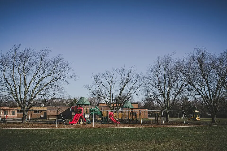 Mt. Pleasant, MI - An elementary school playground sits empty during the lunch hour - usually a beautiful spring day would be filled with th