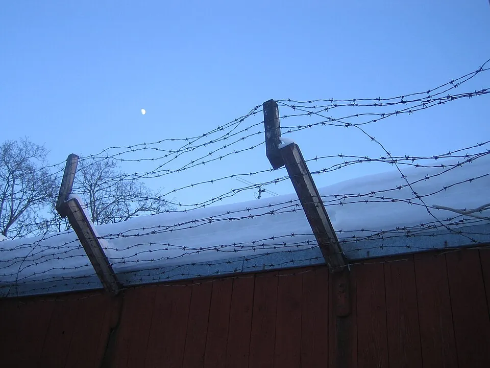 Barbed wire fence with snow.
Taken at the yard of Prison Museum, Hämeenlinna, Finland.